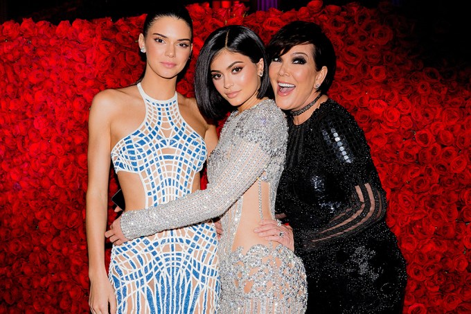 Kris Jenner smiling with Kendall and Kylie