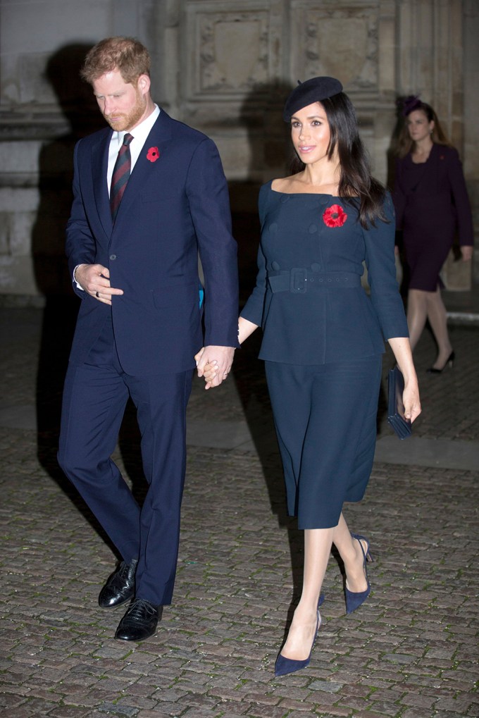Meghan Markle in a Navy Blue Top, Skirt, and Hat