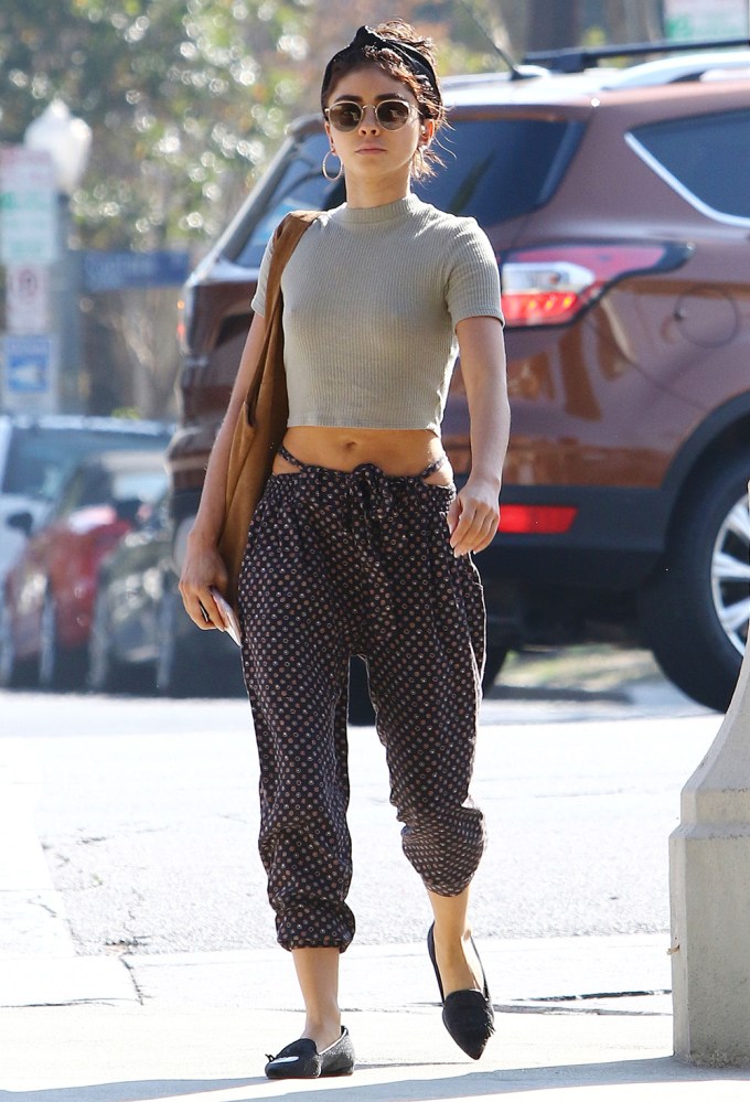 Sarah Hyland in a crop top and patterned pants