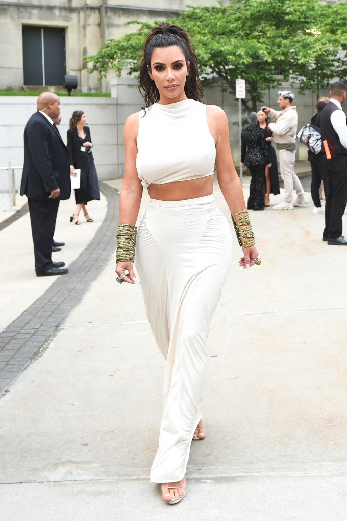Kim Kardashian in a white crop top and skirt