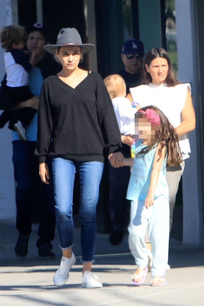 Mila Kunis holds hands with daughter Wyatt while out in Beverly Hills take the kids to lunch in Beverly Hills