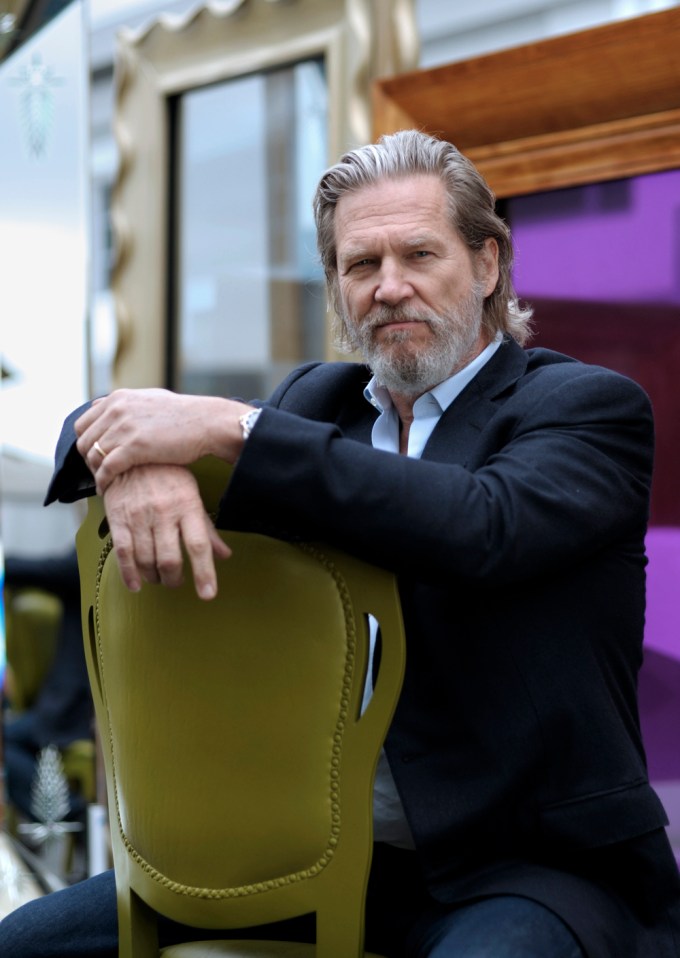 Jeff Bridges posing on a chair
