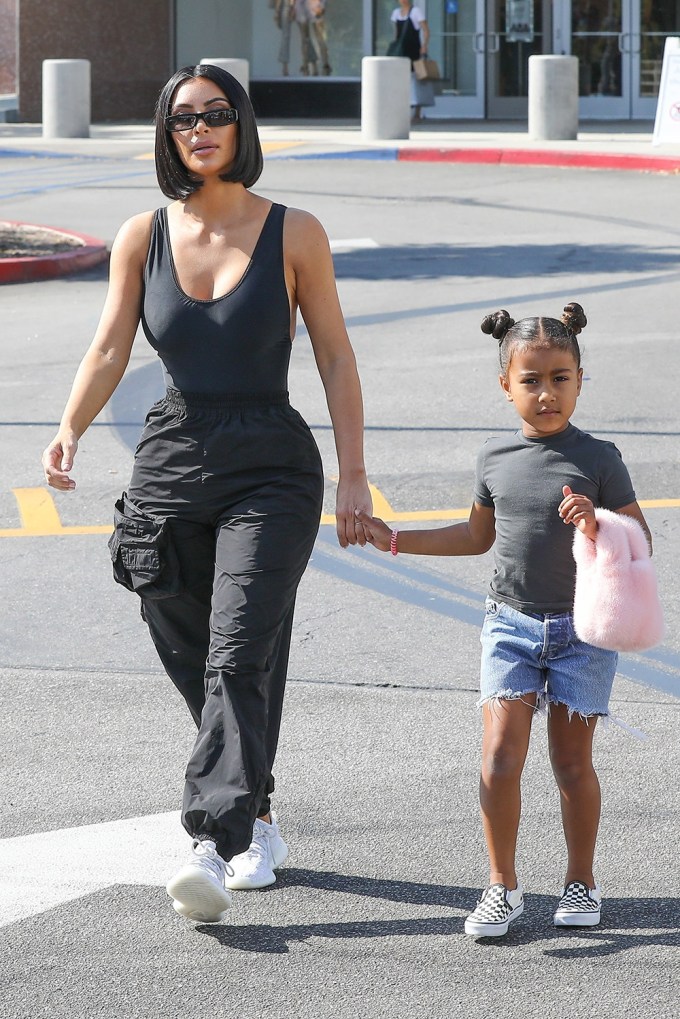 North West With Furry Purse