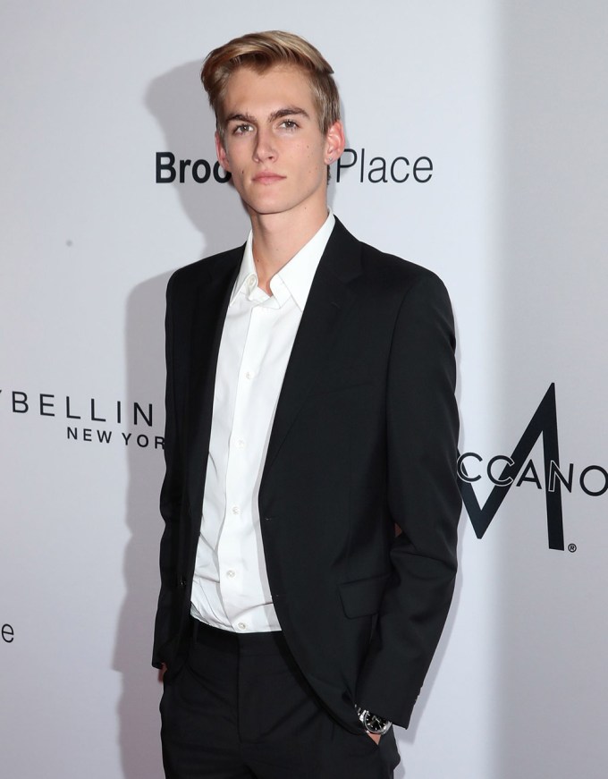 Presley Gerber in a black blazer under a white shirt and pants