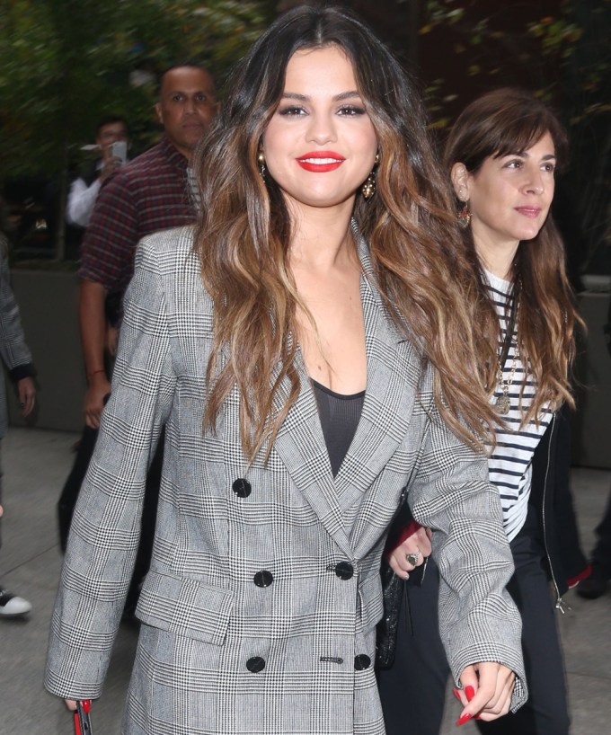 Selena Gomez wearing a grey oversized pantsuit