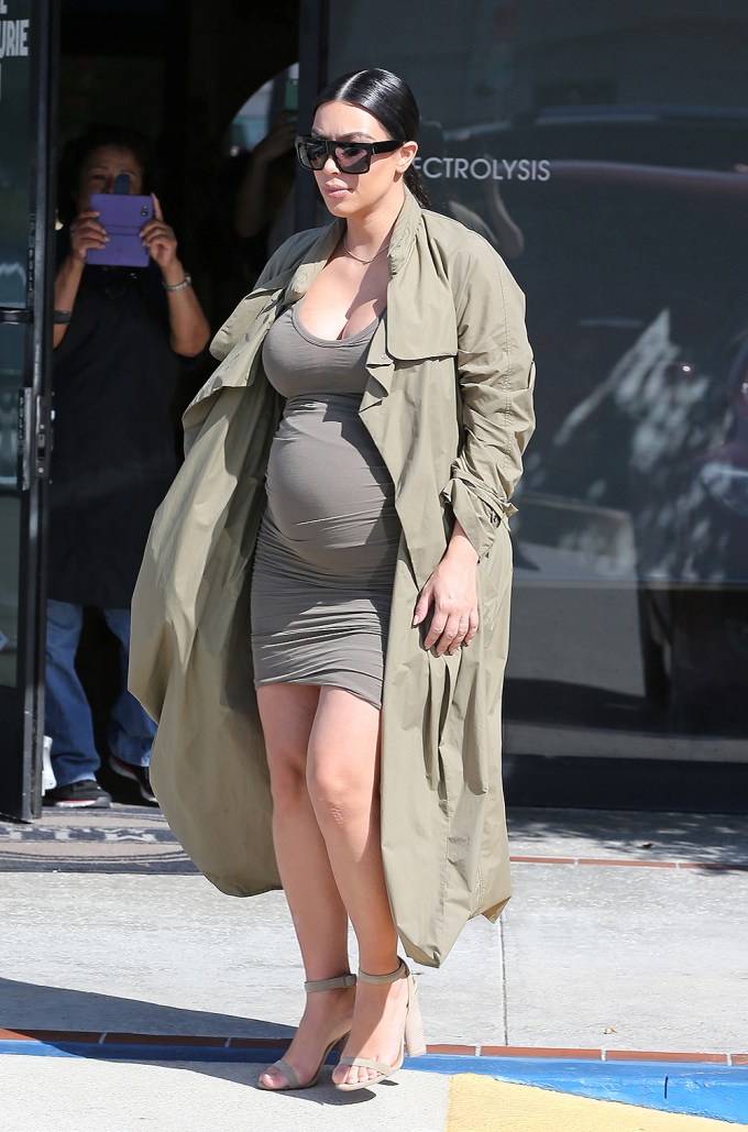 Kim Kardashian pregnant in a green dress
