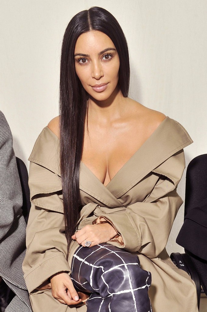 Kim Kardashian in a tan coat