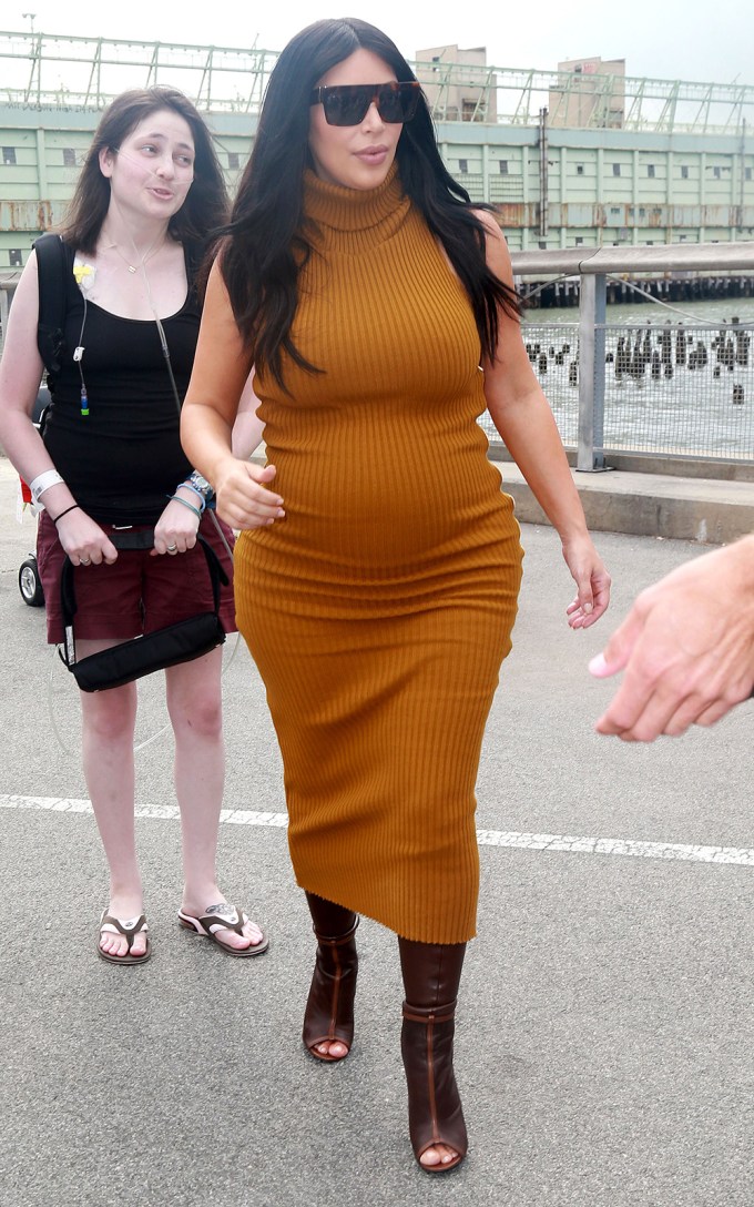 Kim wearing a tight dress