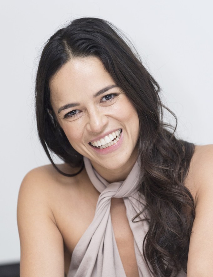 Michelle Rodriguez Smiles For A Photo Shoot