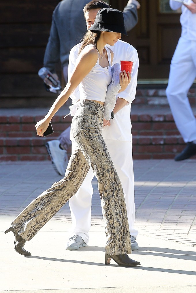 Kendall Jenner walking in snakeskin pants