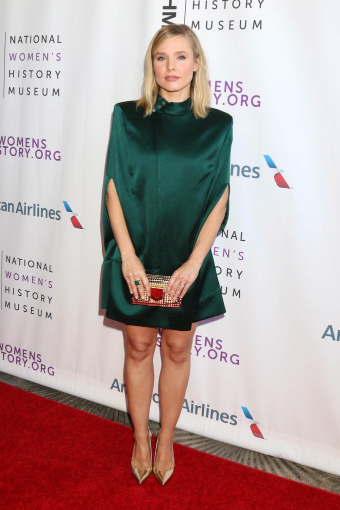 Kristin Bell wears a green mini-dress