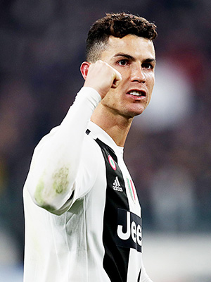 Cristiano Ronaldo gets smooched by Heat mascot 