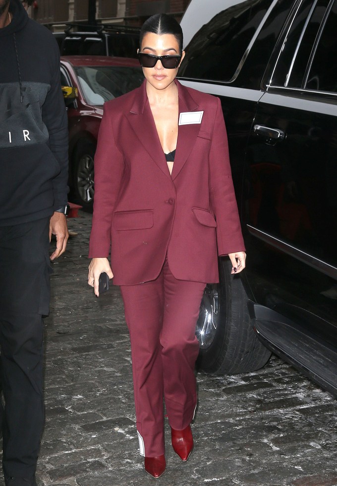 Kourtney Kardashian In A Red Filles A Papa Suit