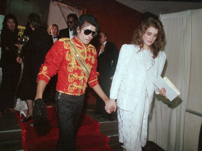 Michael Jackson holds hands with Brooke Shields