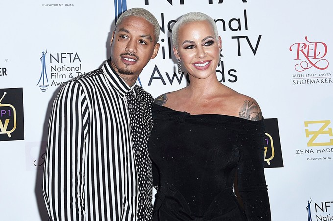Amber Rose In A Srapless Black Dress With Alexander Edwards