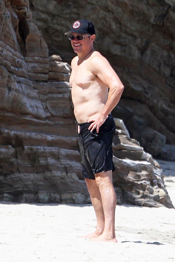 Matt Damon smiles while shirtless