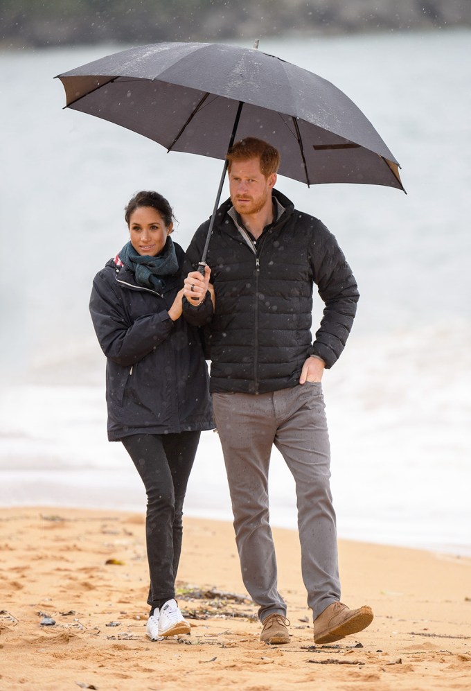Prince Harry & Meghan Markle Share An umbrella