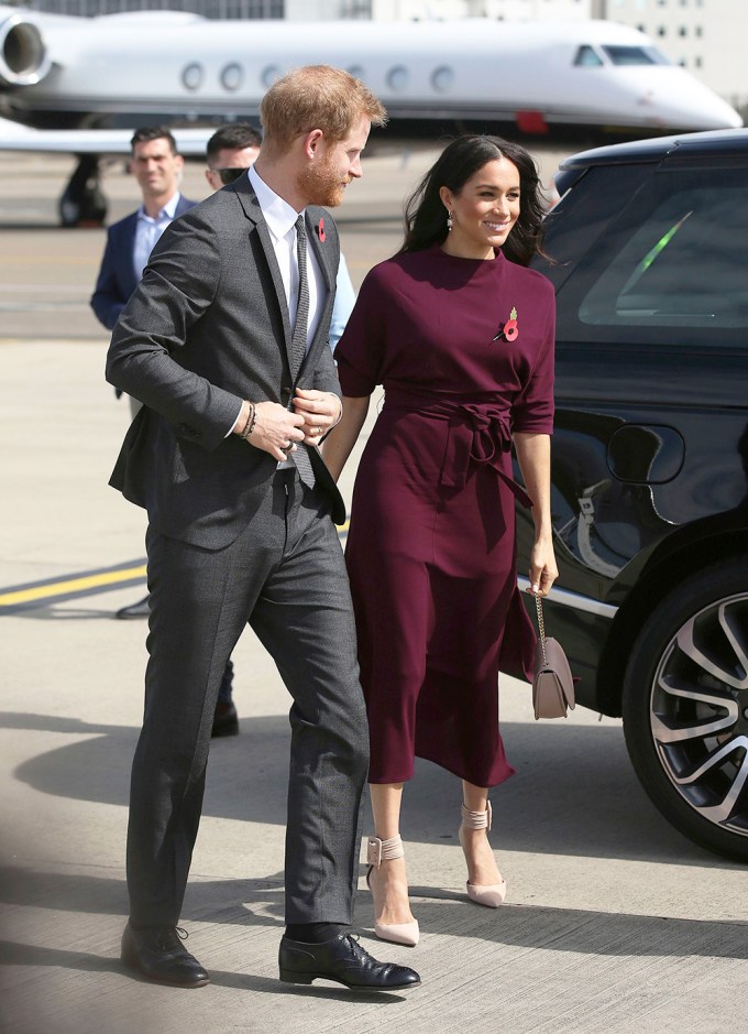 Meghan Markle Stuns In Maroon With Prince Harry