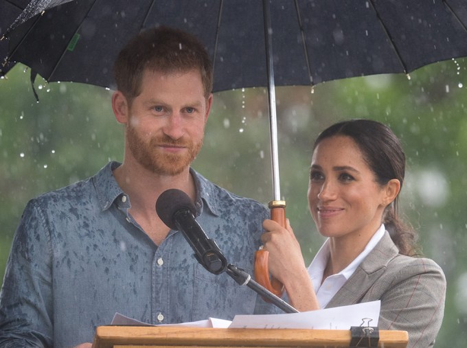 Meghan Markle Protects Prince Harry From The Rain