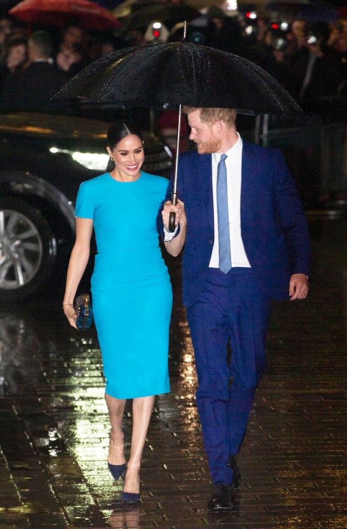 Prince Harry & Meghan Markle Underneath An Umbrella