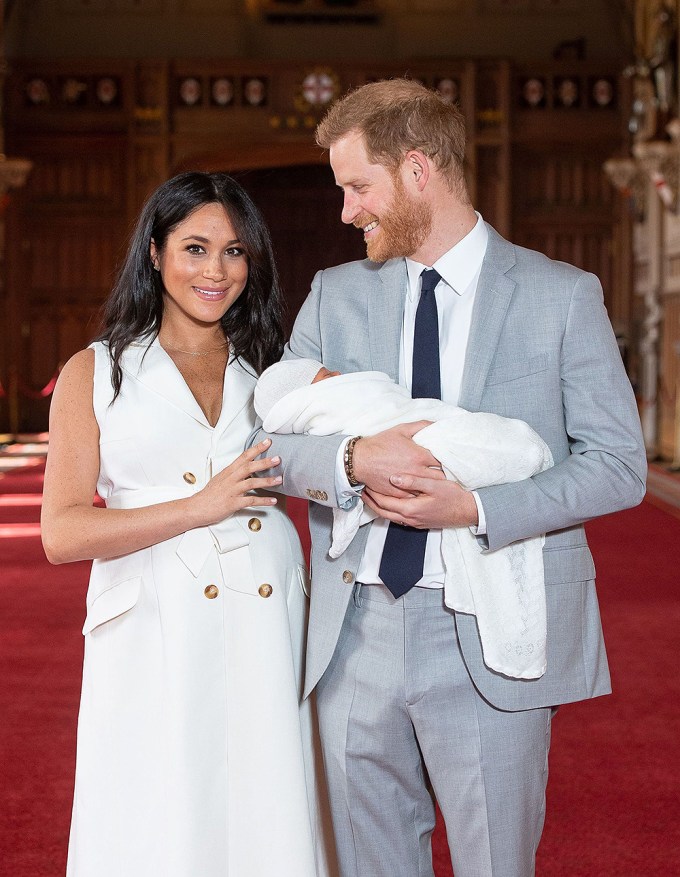 Prince Harry Holds Archie And Smiles At Meghan Markle