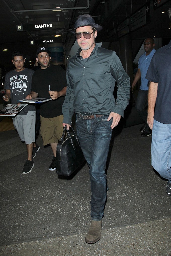 Brad Pitt rocks a fedora at LAX