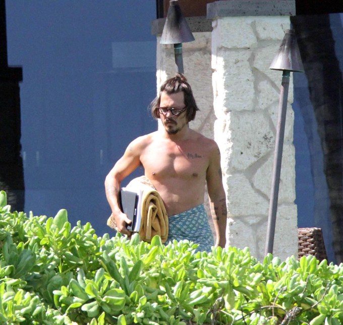 Johnny Depp walking shirtless