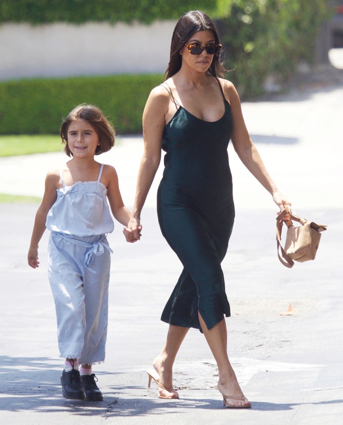 Kourtney Kardashian & Penelope Disick holding hands
