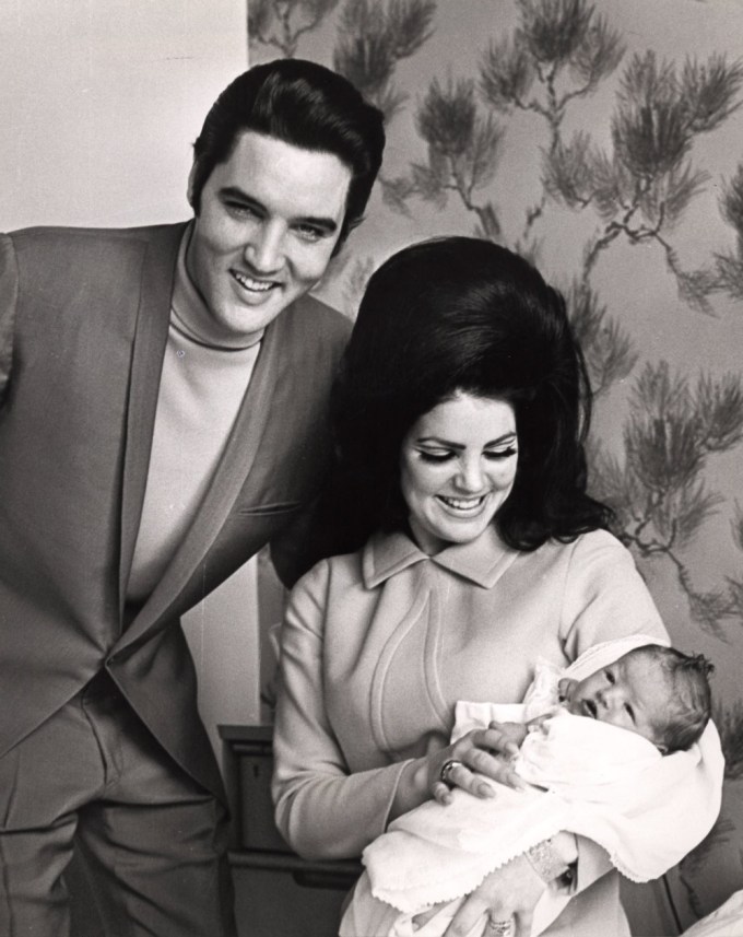 Elvis, Priscilla and Lisa Marie Presley in a happy photo