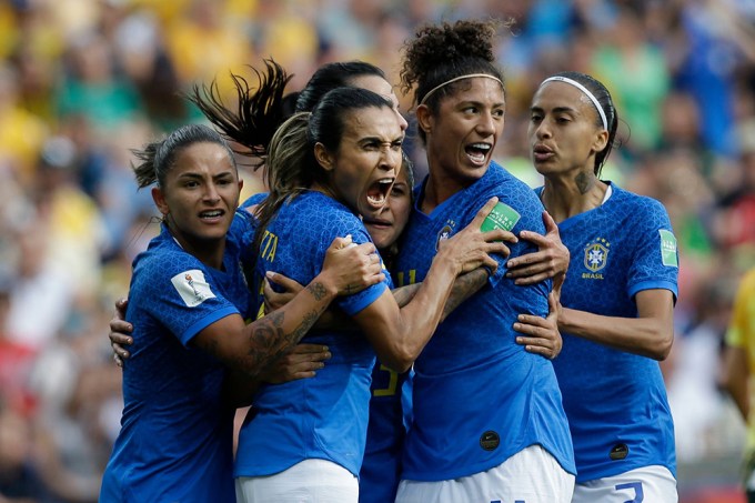 Brazil’s Marta & her teammates celebrate a goal