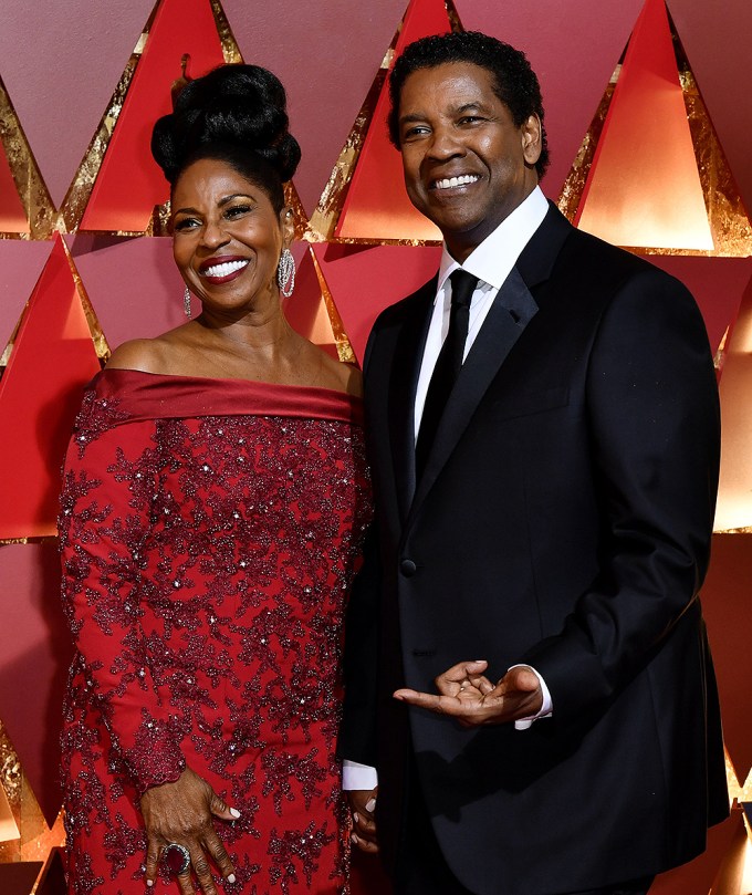 Denzel Washington and Pauletta Washington smile