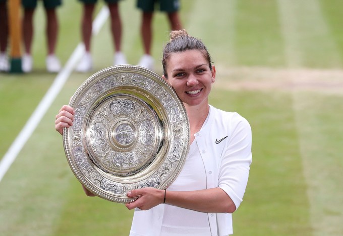 Simona Halep holds her 2019 Wimbledon trophy
