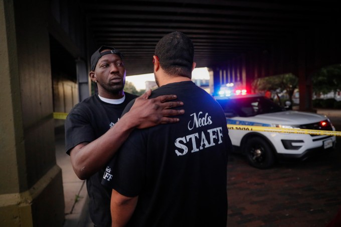Witnesses comfort one another in Dayton, Ohio