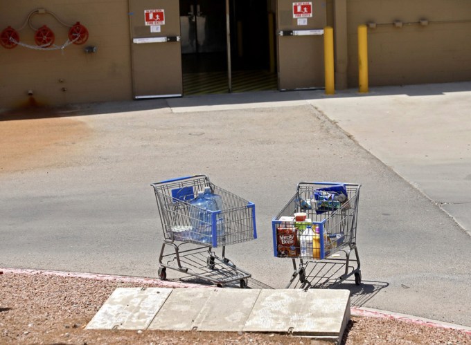 Carts left by shoppers fleeing the Walmart shooting