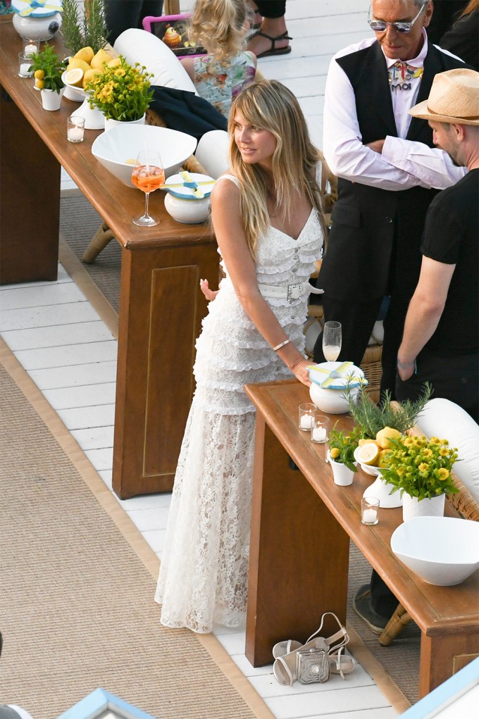 Heidi Klum Wears A Ruffled Lace Dress To Her Pre-Wedding Reception