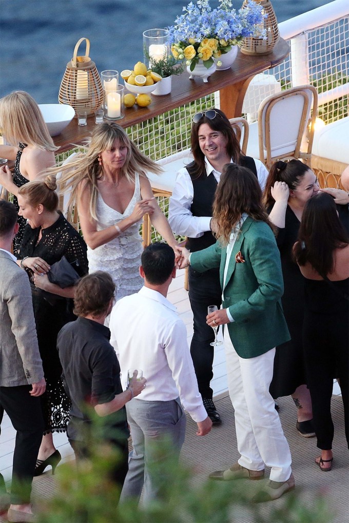 Tom Kaulitz Grabs Heidi Klum’s Hand At Pre-Wedding Reception