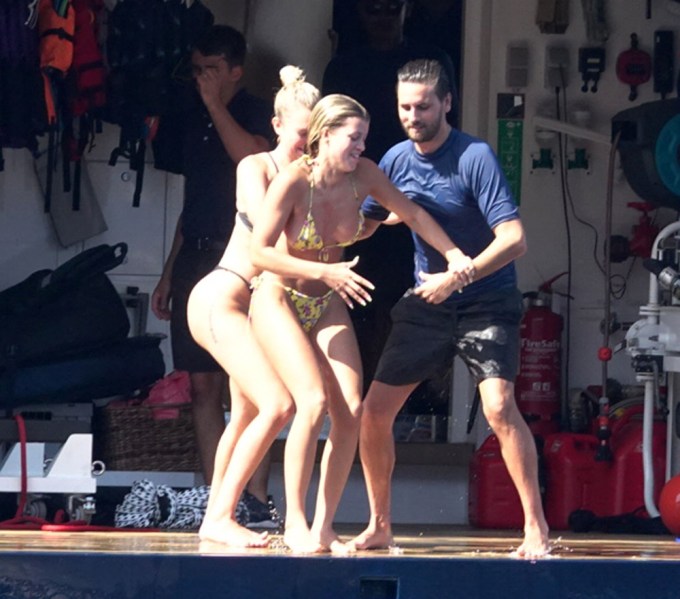 Scott Disick & Sofia Richie having fun as they dive into the sea from their yacht in Positano