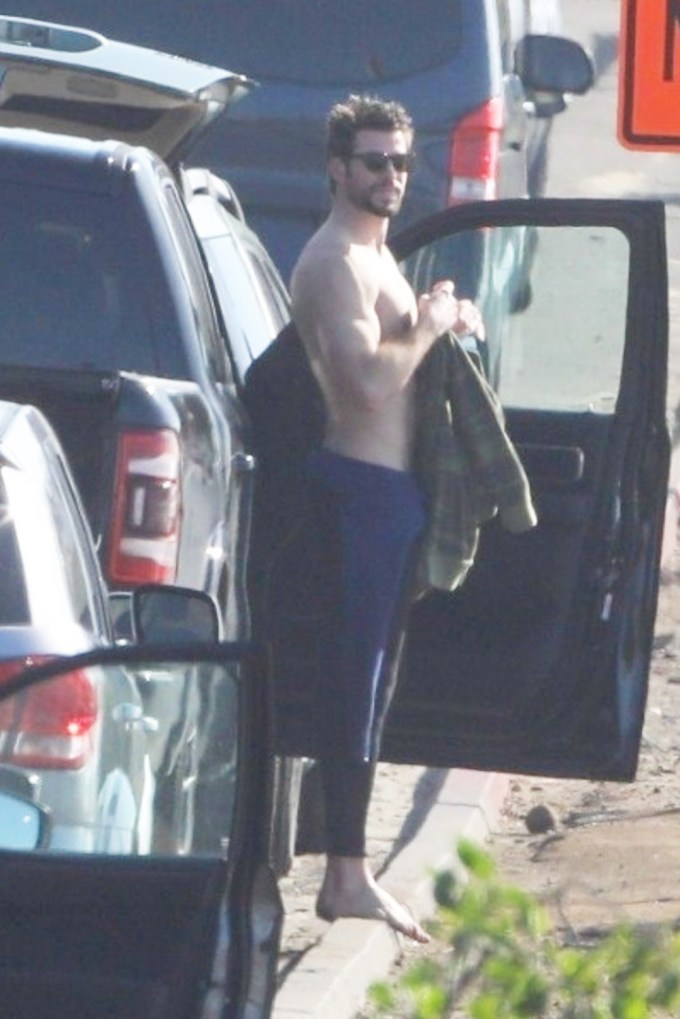 Liam Hemsworth surfing in Malibu with his older brother Luke