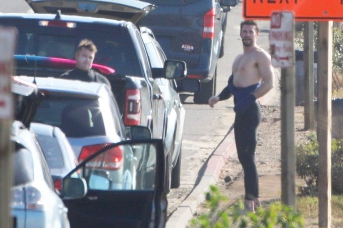 Liam Hemsworth & his brother Luke getting ready for a day of surfing in Malibu