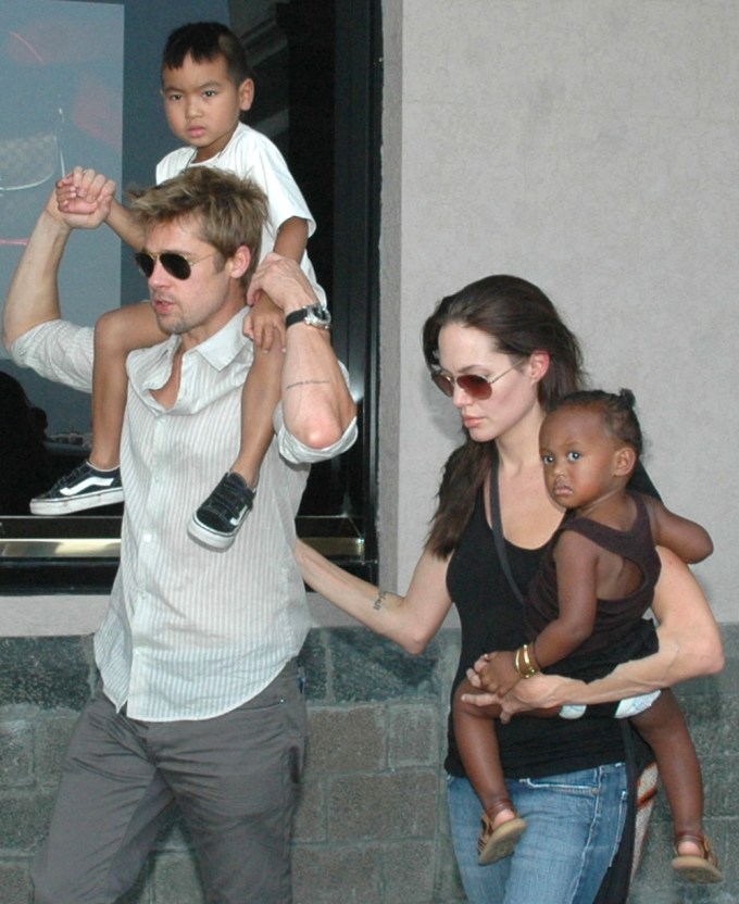 Brad Pitt carries Maddox on his shoulders