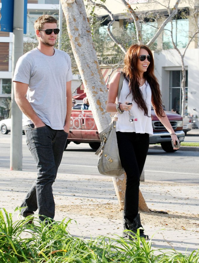 Miley Cyrus & Liam Hemsworth shopping in 2010