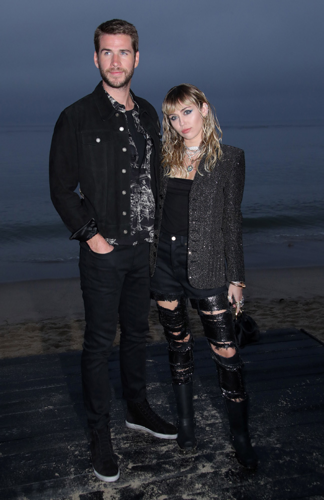 Miley & Liam pose at YSL’s Malibu show