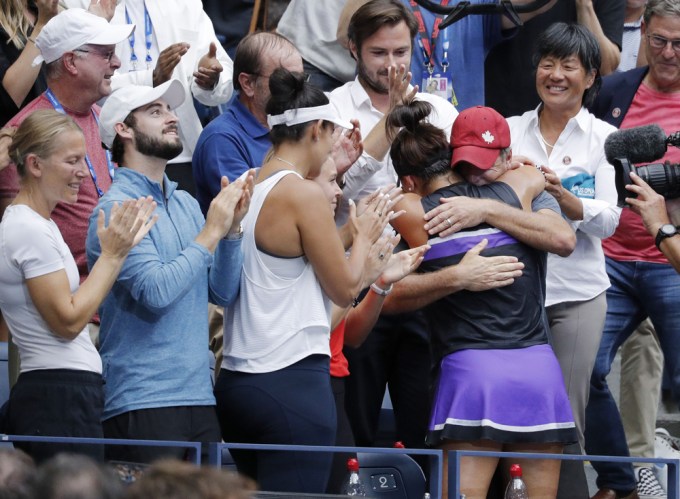 Bianca Andreescu hugs her coach after winning