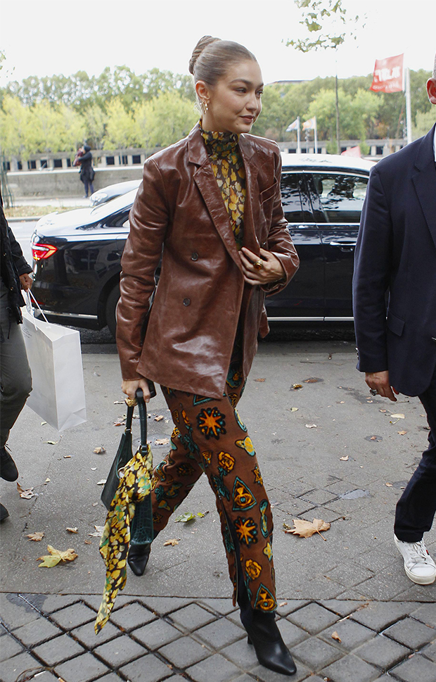 Hailey Bieber in brown printed top and brown flared trousers on April 30 ~  I want her style - What celebrities wore and where to buy it. Celebrity  Style