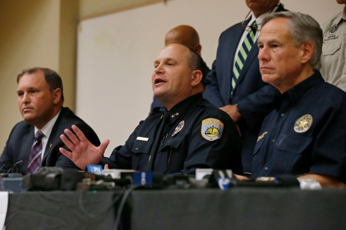 Police speak at a press conference after a mass shooting