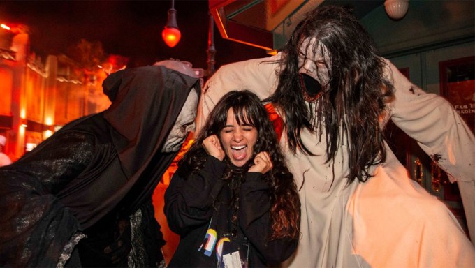 Camila Cabello screams during Halloween Horror Night