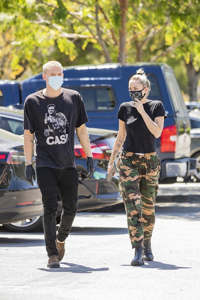 Miley Cyrus rocks a Gucci face mask while out with BF Cody Simpson