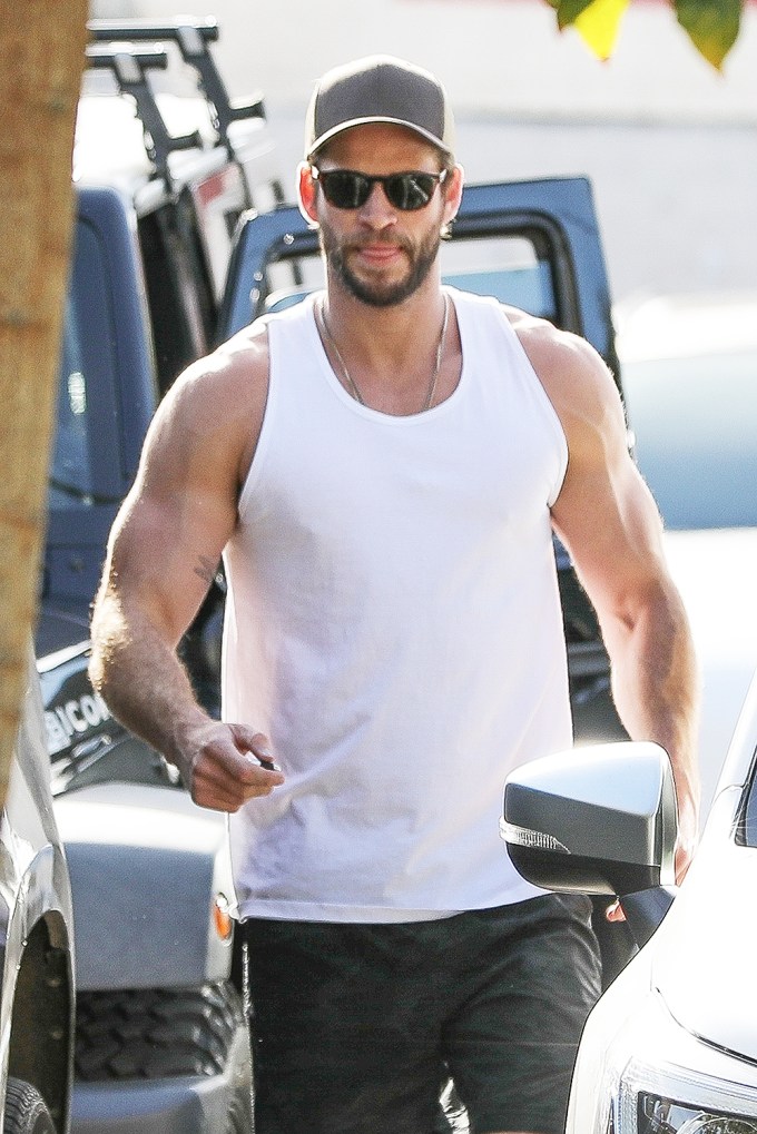 Liam Hemsworth’s biceps are bulging