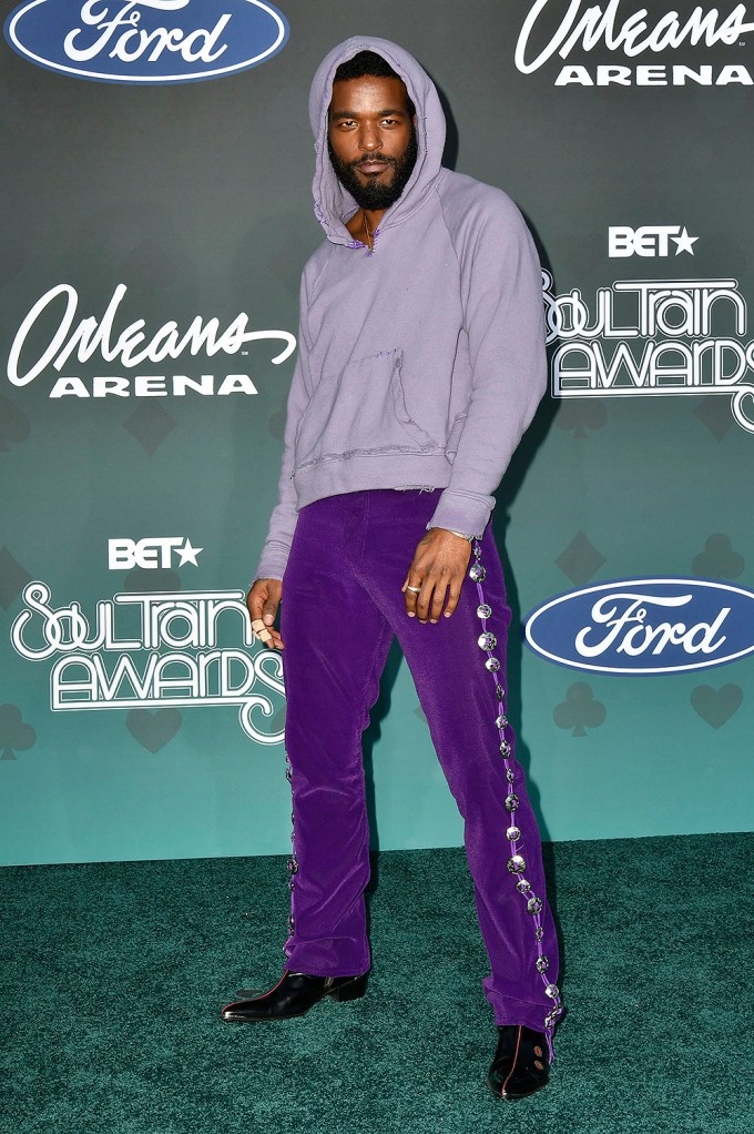 Luke James is casual in purple