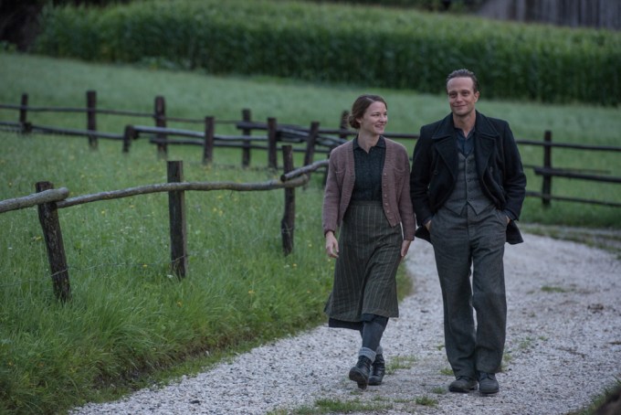 Characters Franz and Fani Jägerstätter walking together before their separation